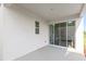 Covered patio with sliding glass doors offering seamless indoor-outdoor living at 2294 Gold Dust Dr, Minneola, FL 34715