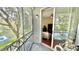 Screened balcony with sliding glass doors offering a view of the lake and access to the living area at 2314 Mid Town Ter # 1126, Orlando, FL 32839