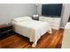 Comfortable bedroom features wood floors, a large bed, and ample closet space at 2314 Mid Town Ter # 1126, Orlando, FL 32839