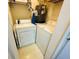 Functional laundry room with washer, dryer, and water heater for convenient chores at 2314 Mid Town Ter # 1126, Orlando, FL 32839