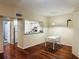 Bright living area showcases kitchen access, wood floors, and neutral colors at 2314 Mid Town Ter # 1126, Orlando, FL 32839