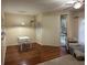 Open floor plan boasts wood floors, a sliding glass door, and comfortable seating at 2314 Mid Town Ter # 1126, Orlando, FL 32839