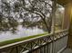 Serene screened porch view overlooking tranquil lake with lush landscaping, relaxing outdoor space at 2314 Mid Town Ter # 1126, Orlando, FL 32839