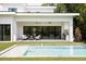 Stunning backyard with a modern outdoor living space and inviting pool at 2412 Chantilly Ave, Winter Park, FL 32789