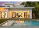 Relaxing backyard oasis featuring a pool, outdoor seating and retractable doors to the main house at 2412 Chantilly Ave, Winter Park, FL 32789