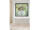 Elegant bathroom with a soaking tub and backyard view at 2412 Chantilly Ave, Winter Park, FL 32789