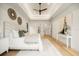 Bright bedroom featuring hardwood floors, tray ceiling and neutral decor at 2412 Chantilly Ave, Winter Park, FL 32789