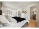 Spacious bedroom features minimalist decor and ample natural light. Bath is viewed through door at 2412 Chantilly Ave, Winter Park, FL 32789