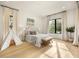 Bright bedroom features a sunlit space with large windows and a teepee, providing a cozy and playful atmosphere at 2412 Chantilly Ave, Winter Park, FL 32789