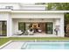 Home exterior with open living spaces, backyard pool, outdoor seating, and a built-in outdoor grill at 2412 Chantilly Ave, Winter Park, FL 32789