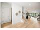 Welcoming foyer with hardwood floors, staircase, and an open floor plan at 2412 Chantilly Ave, Winter Park, FL 32789