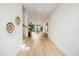 Bright hallway with modern decor and hardwood floors leads to living spaces at 2412 Chantilly Ave, Winter Park, FL 32789