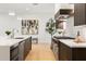 Bright kitchen features modern appliances, an island sink, and stylish hardwood flooring at 2412 Chantilly Ave, Winter Park, FL 32789