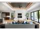Inviting living room with a fireplace, wood ceiling, hardwood floors, and access to the backyard at 2412 Chantilly Ave, Winter Park, FL 32789