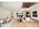 Open-concept living room and dining area with hardwood floors and modern decor at 2412 Chantilly Ave, Winter Park, FL 32789