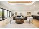 Open-concept living room featuring hardwood floors, modern furnishings, and bright, natural light at 2412 Chantilly Ave, Winter Park, FL 32789