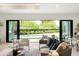 Open living area with sliding glass doors to the backyard and a view of the pool at 2412 Chantilly Ave, Winter Park, FL 32789