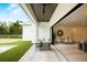 Inviting outdoor patio with comfortable seating overlooking the well-manicured backyard at 2412 Chantilly Ave, Winter Park, FL 32789