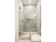Glass enclosed shower with decorative stone base and built-in alcove provides a spa-like feel at 2412 Chantilly Ave, Winter Park, FL 32789