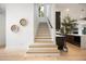 Elegant stairway with hardwood steps and modern railings at 2412 Chantilly Ave, Winter Park, FL 32789