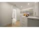 Well-organized walk-in closet has custom shelving and access to the primary bathroom at 2412 Chantilly Ave, Winter Park, FL 32789