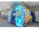 Games like Guitar Hero and claw machines are lined up in this community gaming area at 2778 Almaton Loop # 302, Kissimmee, FL 34747