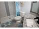Modern bathroom with stylish granite vanity top, decorative shower, and updated fixtures at 2778 Almaton Loop # 302, Kissimmee, FL 34747