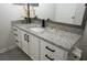 Bathroom featuring granite countertop vanity, black hardware, and modern fixtures at 2778 Almaton Loop # 302, Kissimmee, FL 34747