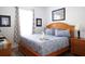 Comfortable bedroom with a plush queen bed, complemented by stylish furnishings and a swan towel art at 2778 Almaton Loop # 302, Kissimmee, FL 34747