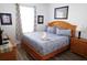 Comfortable bedroom with a plush queen bed, complemented by stylish furnishings and a swan towel art at 2778 Almaton Loop # 302, Kissimmee, FL 34747
