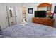 Well-appointed bedroom showcasing a queen bed, decorative accents, and an en-suite bathroom at 2778 Almaton Loop # 302, Kissimmee, FL 34747