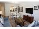 Comfortable living room with an open view to the dining area and kitchen for easy entertaining at 2778 Almaton Loop # 302, Kissimmee, FL 34747