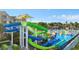 A colorful community water park featuring winding slides, a splash zone, and lounge seating near the pool at 2778 Almaton Loop # 302, Kissimmee, FL 34747