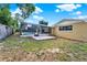 Expansive backyard featuring a screened-in pool and outdoor patio area at 2809 Pioneer Rd, Orlando, FL 32808