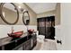 This bathroom has 2 bowl sinks and a dark colored shower curtain at 2809 Pioneer Rd, Orlando, FL 32808
