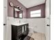 This bathroom has a black vanity with a large mirror at 2809 Pioneer Rd, Orlando, FL 32808
