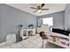This bedroom is roomy and has nice tile floors and a ceiling fan at 2809 Pioneer Rd, Orlando, FL 32808