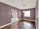 Dining room featuring hardwood floors, a window with blinds, and neutral painted walls at 2809 Pioneer Rd, Orlando, FL 32808