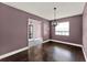 Dining room featuring hardwood floors, a window with blinds, and neutral painted walls at 2809 Pioneer Rd, Orlando, FL 32808