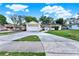 Charming one-story home featuring an attached garage, lush lawn, and a concrete driveway at 2809 Pioneer Rd, Orlando, FL 32808