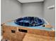 This is a jacuzzi tub with blue interior and tile surround at 2809 Pioneer Rd, Orlando, FL 32808