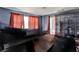 Spacious living room features hardwood floors, ample natural light, and two large windows at 2809 Pioneer Rd, Orlando, FL 32808
