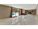 Living Room with fireplace, porcelain tile flooring, and pool views through sliding glass doors at 2809 Pioneer Rd, Orlando, FL 32808