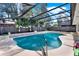 Refreshing screened pool with clear blue water, ideal for summertime fun at 2809 Pioneer Rd, Orlando, FL 32808