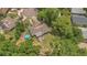 Aerial view of the property featuring a pool and wooded backyard at 300 Hickory Ct, Apopka, FL 32712