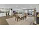 Open concept dining and living area with modern floors and abundant natural light at 300 Hickory Ct, Apopka, FL 32712