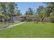Charming home with a well-manicured lawn, gray brick, and inviting walkway at 300 Hickory Ct, Apopka, FL 32712