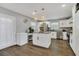 Bright kitchen with white cabinets, stainless steel appliances, and granite countertops at 300 Hickory Ct, Apopka, FL 32712