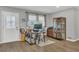 Bright office space with a modern desk, ample storage, and a decorative glass front door at 300 Hickory Ct, Apopka, FL 32712
