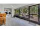 Enclosed porch with tile floors includes laundry and views of outdoor seating area at 300 Hickory Ct, Apopka, FL 32712